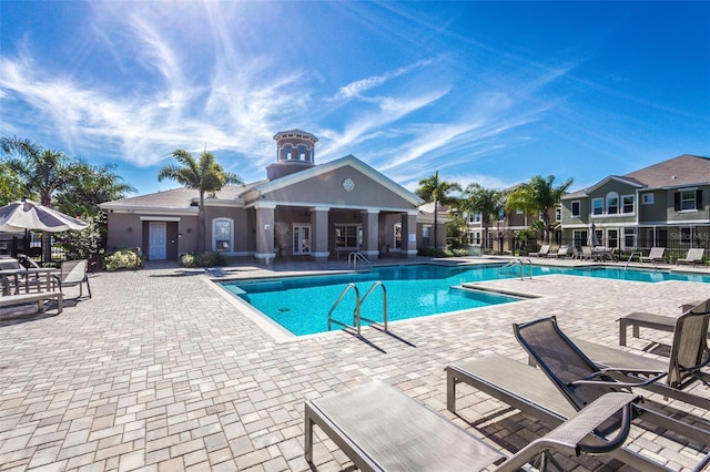 view of swimming pool with a patio