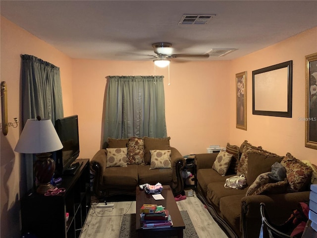 living room featuring ceiling fan and light wood-type flooring