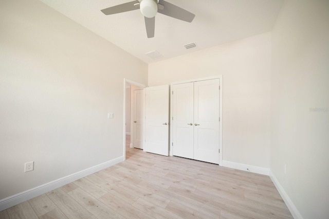 unfurnished bedroom featuring a closet, ceiling fan, and light hardwood / wood-style flooring