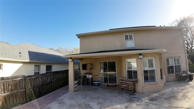 back of house with a patio area