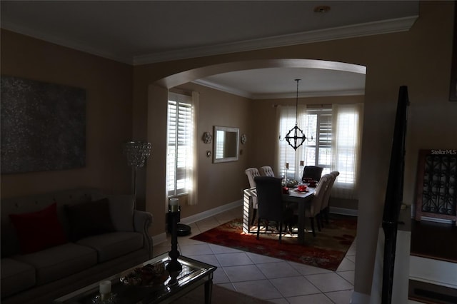 tiled living room with a notable chandelier and ornamental molding