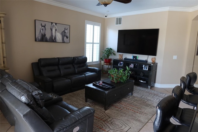 living room with light tile floors, ceiling fan, and crown molding