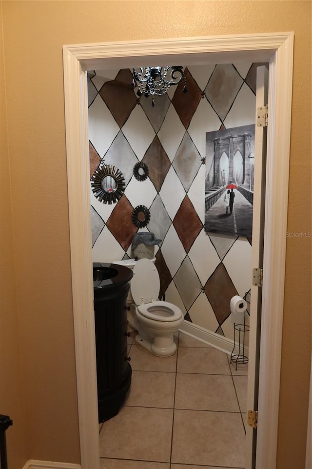 bathroom featuring toilet and tile floors