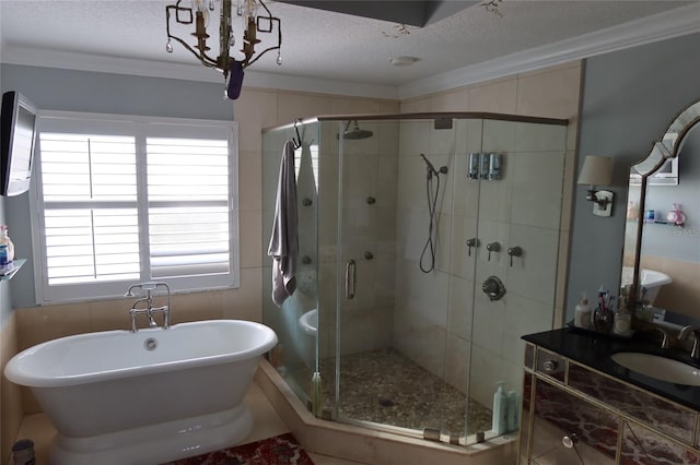 bathroom featuring tile flooring, independent shower and bath, a notable chandelier, a textured ceiling, and vanity