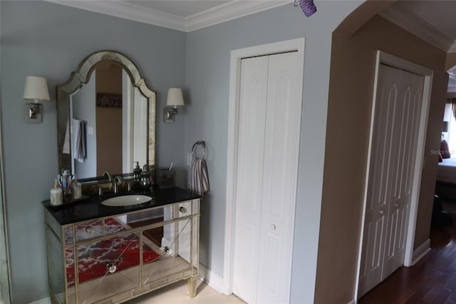 interior space with crown molding, dark wood-type flooring, and sink