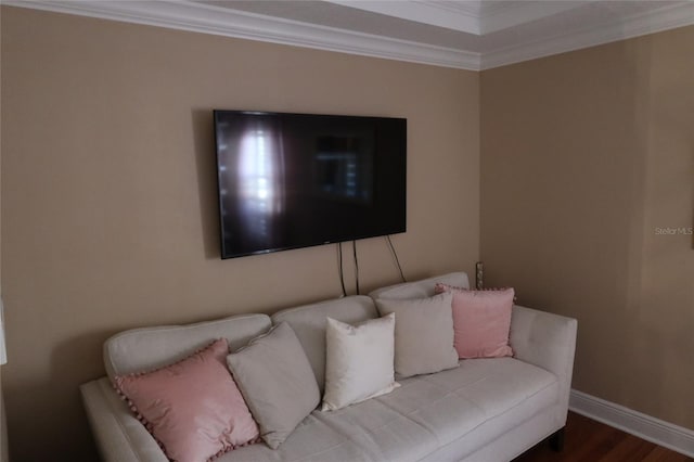 living room featuring dark hardwood / wood-style floors and ornamental molding