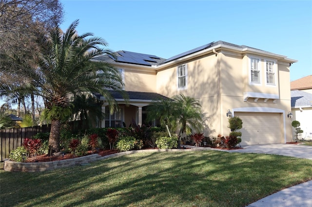 mediterranean / spanish home with solar panels and a front yard