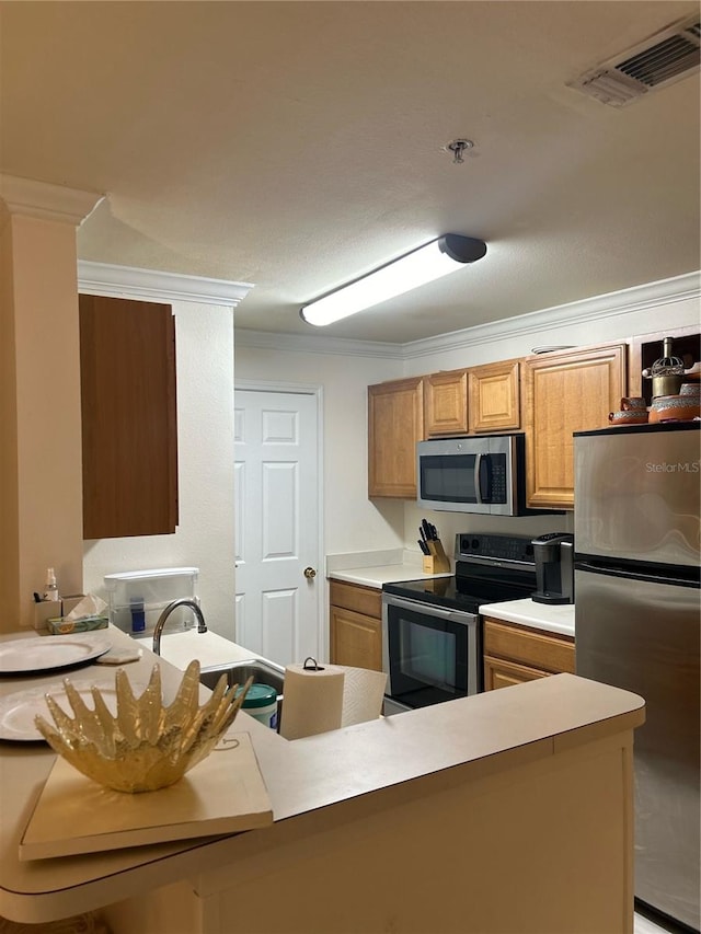 kitchen with kitchen peninsula, stainless steel appliances, ornamental molding, and sink