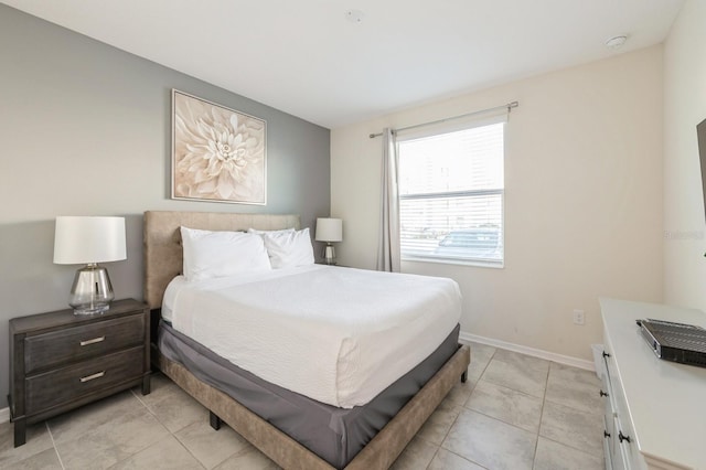 bedroom featuring light tile floors