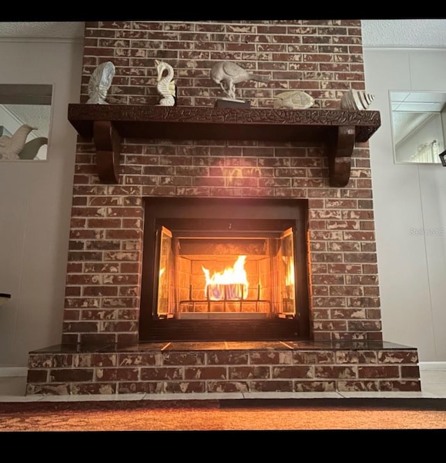 interior details with a brick fireplace