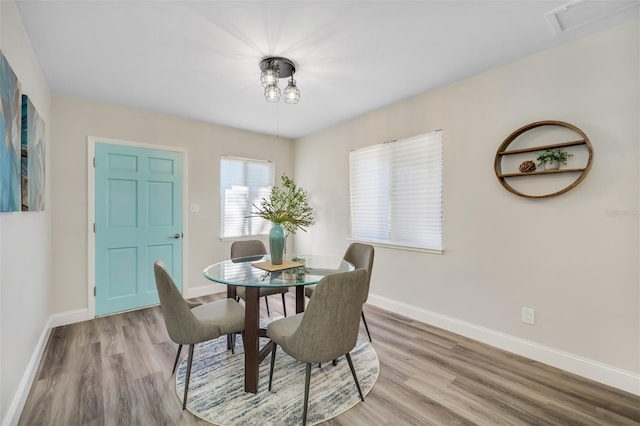 dining area with light hardwood / wood-style flooring