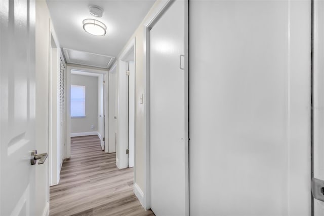 corridor featuring light hardwood / wood-style flooring