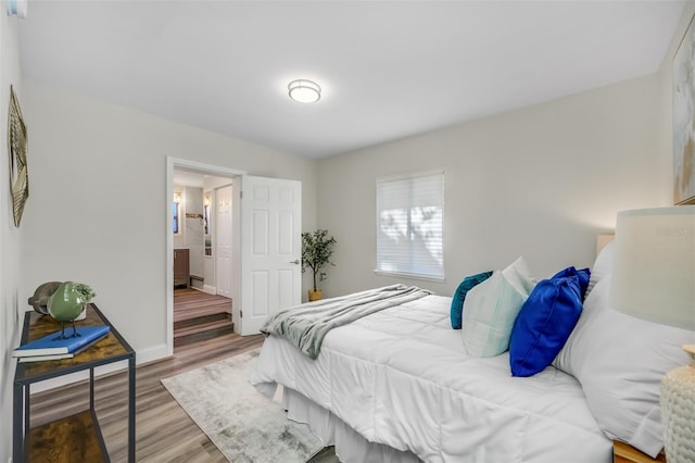 bedroom with light hardwood / wood-style floors