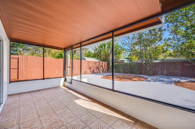 unfurnished sunroom featuring wooden ceiling