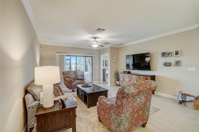 living room featuring baseboards, visible vents, a ceiling fan, light wood-style flooring, and ornamental molding