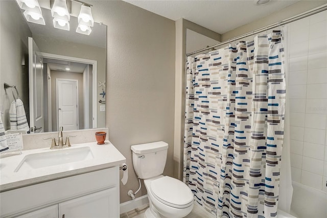 full bathroom featuring a textured wall, vanity, toilet, and shower / bath combo with shower curtain