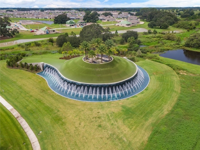 drone / aerial view featuring a residential view and a water view