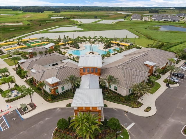 drone / aerial view featuring a residential view and a water view