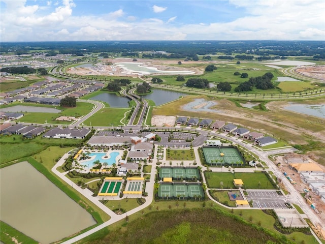 birds eye view of property with a water view