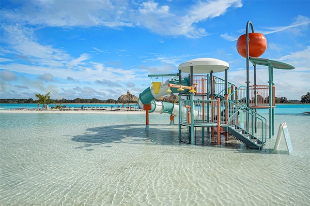 community jungle gym featuring a water view