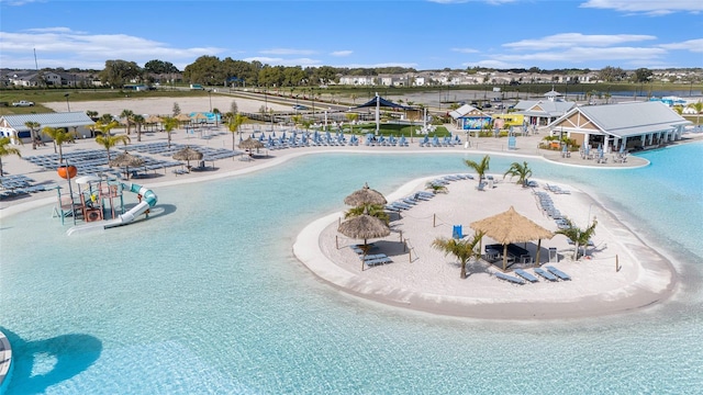 aerial view featuring a water view and a beach view