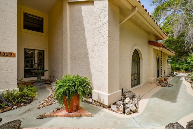 doorway to property with a patio area