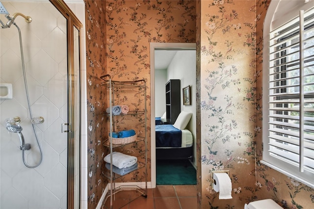 bathroom featuring an enclosed shower and tile floors