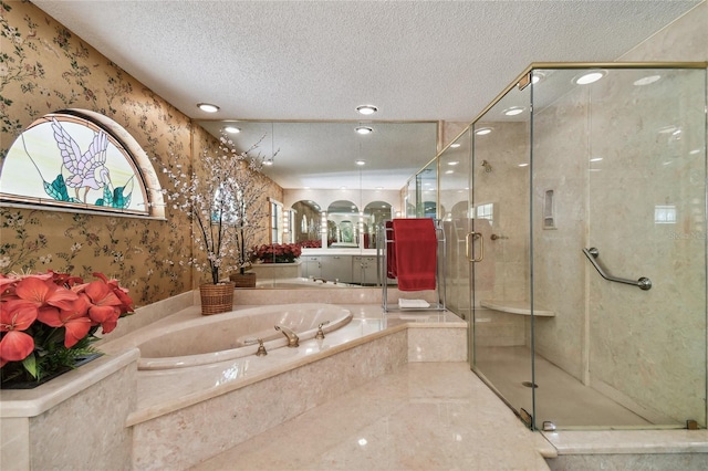 bathroom with a textured ceiling, independent shower and bath, tile floors, and vanity