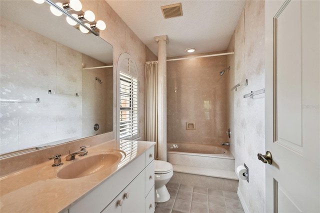 full bathroom with shower / tub combo, vanity, tile flooring, toilet, and a textured ceiling