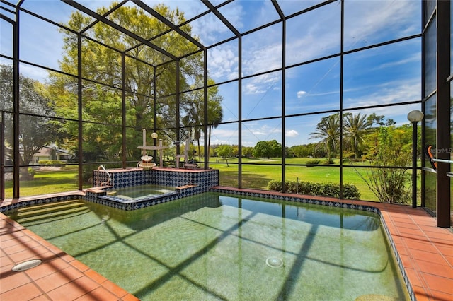 view of swimming pool with an in ground hot tub and a lanai