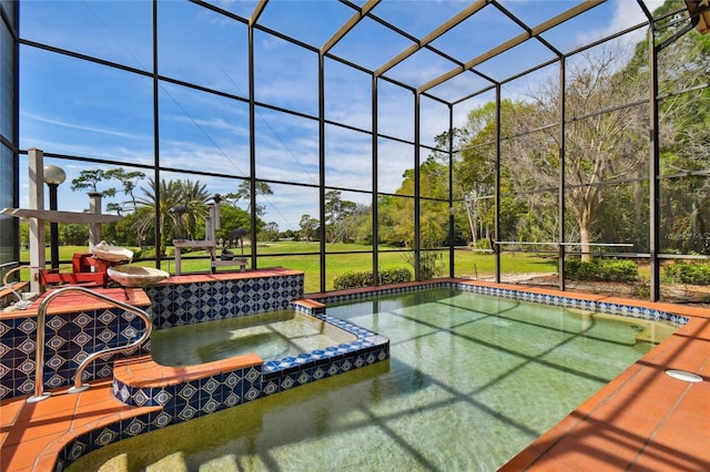 view of swimming pool featuring an in ground hot tub and a lanai