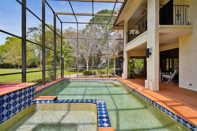 view of pool with a patio and a lanai