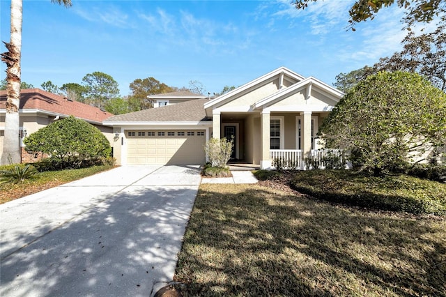 view of front of home featuring covered porch and a garage