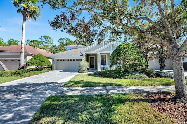 view of front of home with a garage and a front lawn