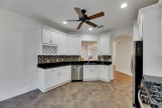 kitchen featuring sink, white cabinetry, and stainless steel appliances