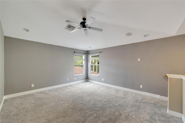 unfurnished room with light carpet and ceiling fan