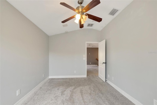 unfurnished room with ceiling fan, light colored carpet, and vaulted ceiling