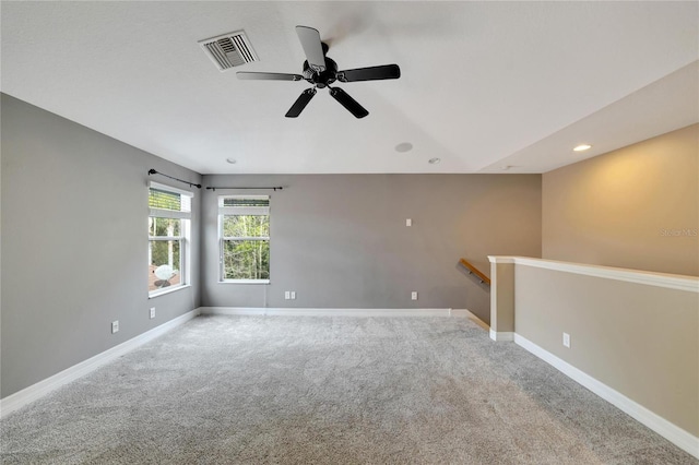 unfurnished room with carpet floors and ceiling fan