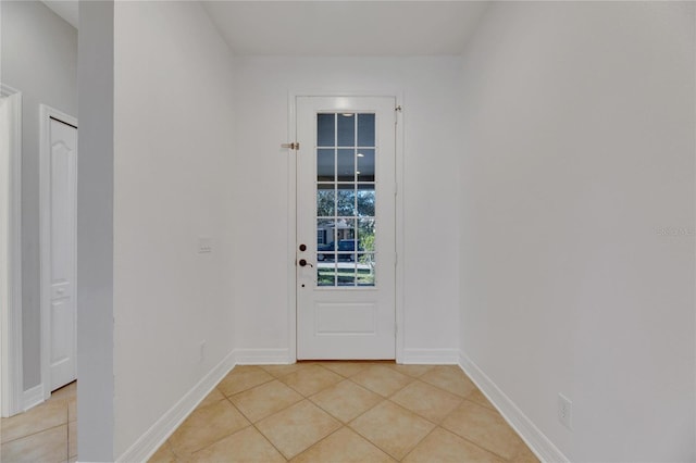 doorway to outside featuring light tile patterned floors