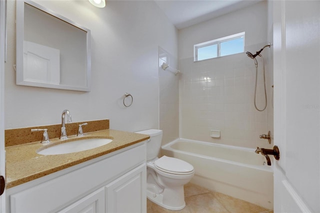 full bathroom with tile patterned floors, toilet, vanity, and tiled shower / bath