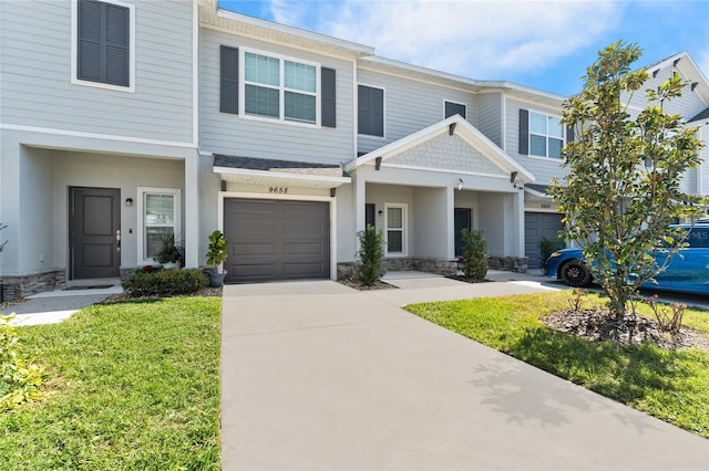 view of front of house with a garage and a front lawn