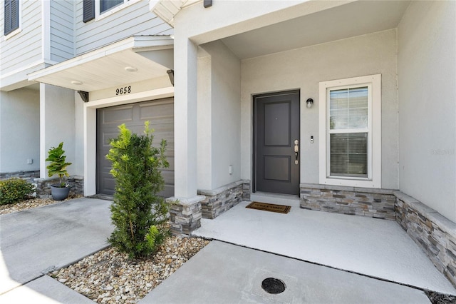 entrance to property featuring a garage