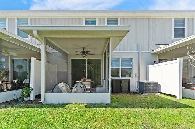 exterior space featuring a yard, central AC unit, and ceiling fan