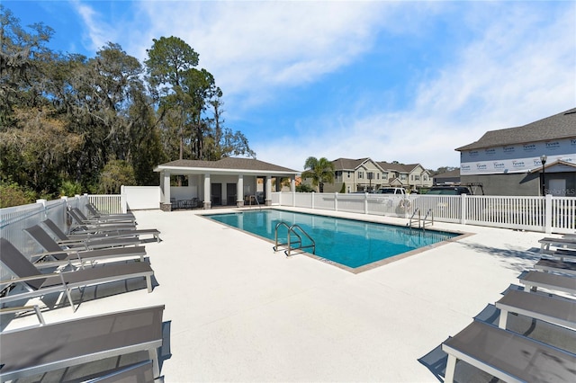 view of swimming pool with a patio area