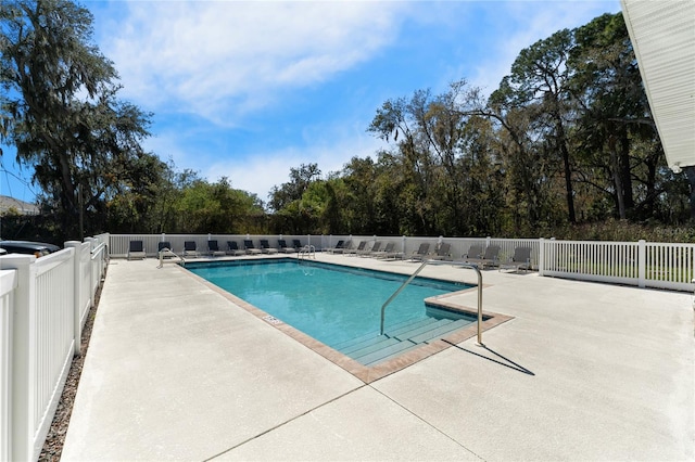 view of swimming pool with a patio area