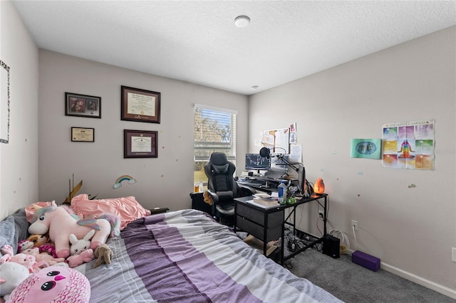 bedroom with carpet and a textured ceiling