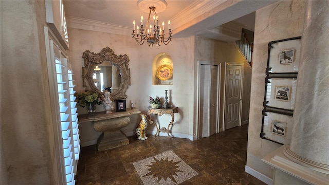 hall featuring dark tile floors, ornamental molding, ornate columns, and an inviting chandelier