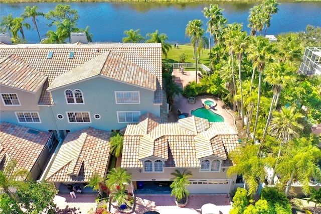 birds eye view of property with a water view