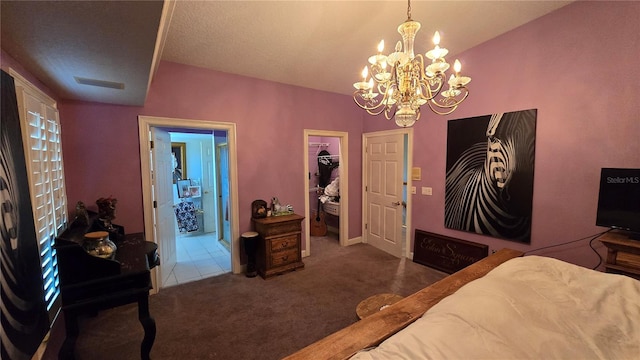 carpeted bedroom featuring a notable chandelier and a textured ceiling