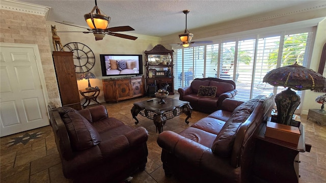 tiled living room with a textured ceiling, crown molding, and ceiling fan